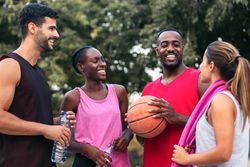 Team Spirit: Multiracial Friends Chatting and Bonding After a Fun Basketball Game