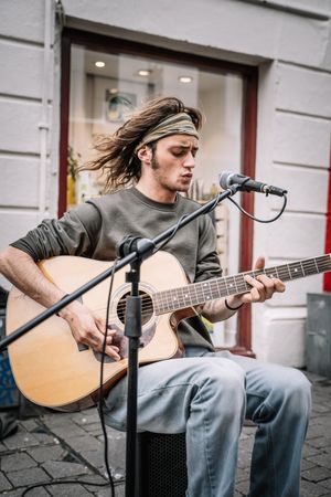 Male musician performing in the street