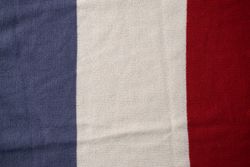 Triple color grey milk and red on knitted fabric background texture.