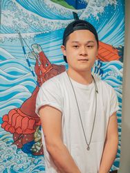 Asian male standing on canvas background