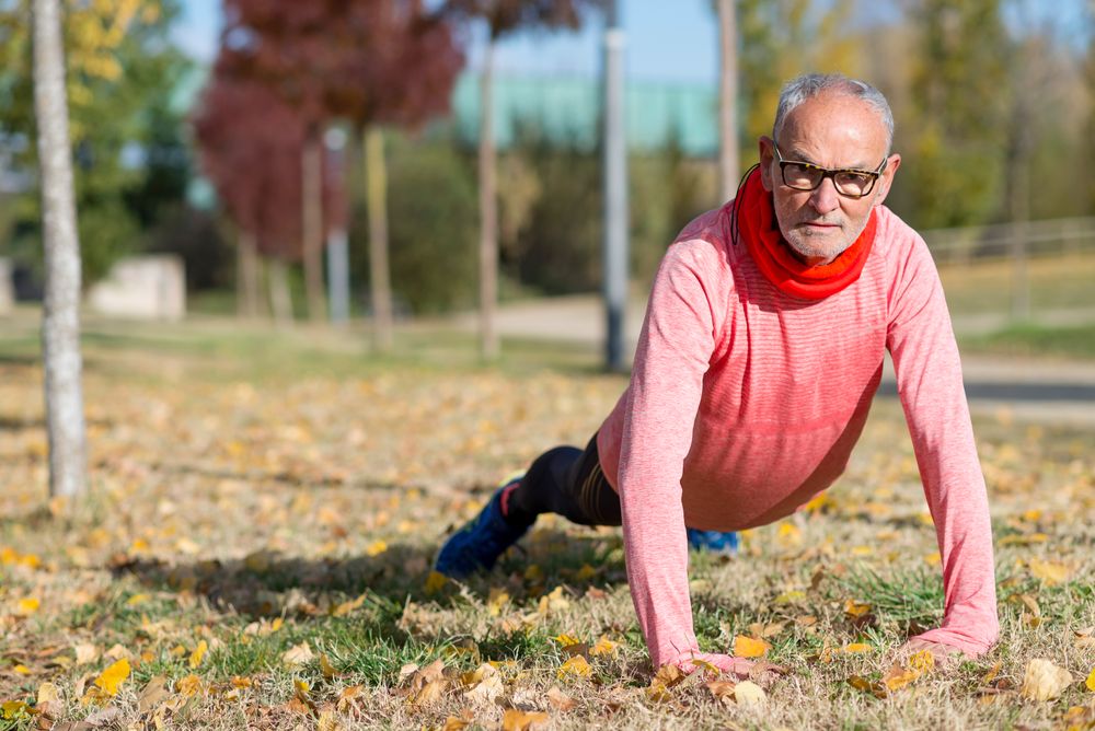 Male doing planks in park
