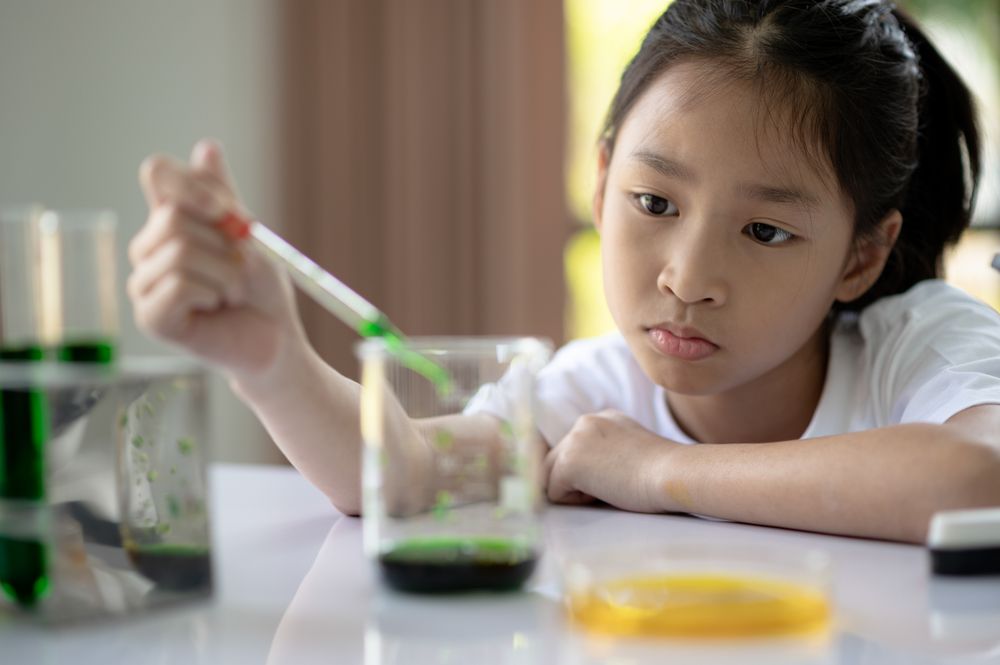 A girl doing a science experiment.