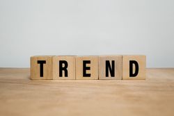 trend words text on wooden blocks on wooden surface