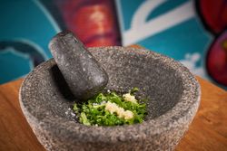 Onion in mortar with pestle