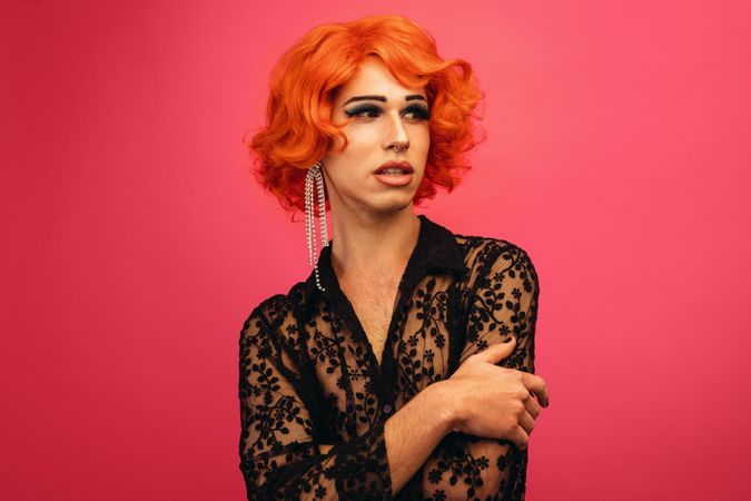 Portrait of drag queen on red background