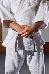 Anonymous man standing in kimono