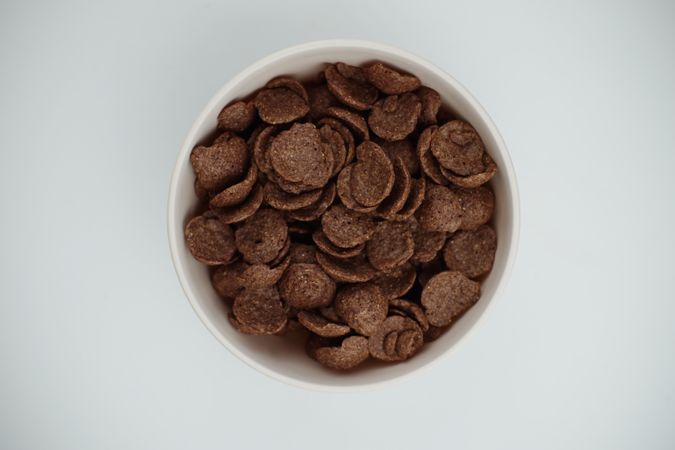 A bowl of chocolate flakes on a table