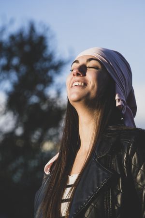 Young woman with cancer bandana