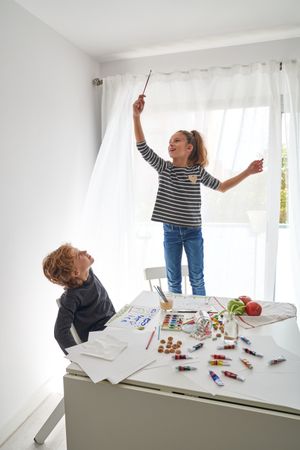 Children playing at home on windy morning