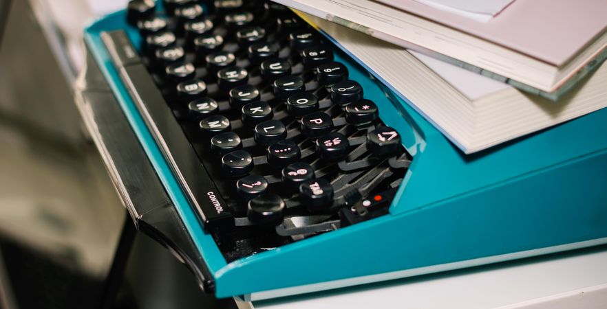 Vintage typewriter in turquoise color