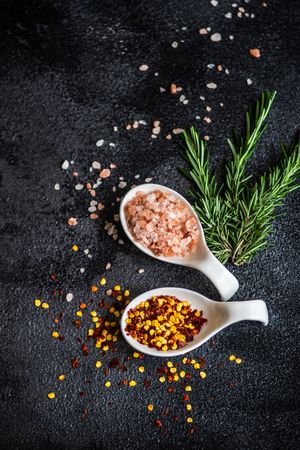Cooking concept with rosemary, chilli flakes and salt