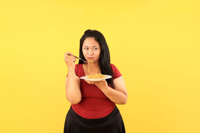 Woman Eating Instant Noodle with Bombastic Side Eye