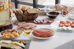 Stylish serving dishes with sandwich for breakfast