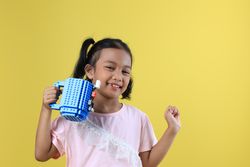 Asian Girl Kids Drink Water from Blue Cute Cup