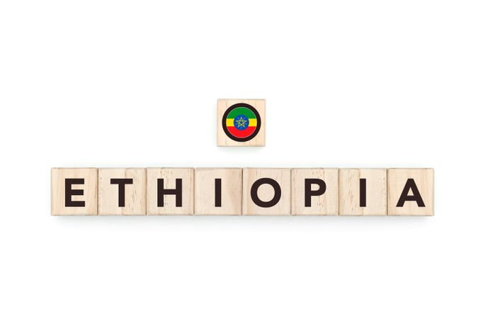 Wooden blocks bearing the name and flag of Ethiopia. Ethiopian and African Culture, national identity, travel, and geography in a copy space design.