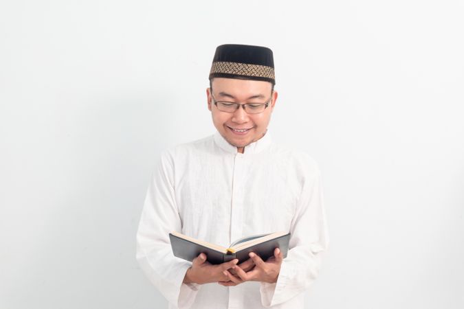 Asian Muslim man  reading quran during Ramadan