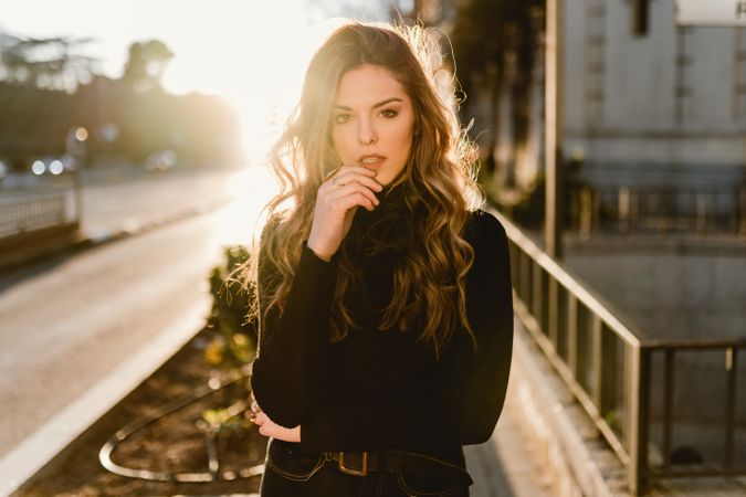 Stylish woman standing near metro station