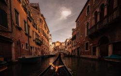 Golden bird gondola floating between colored houses