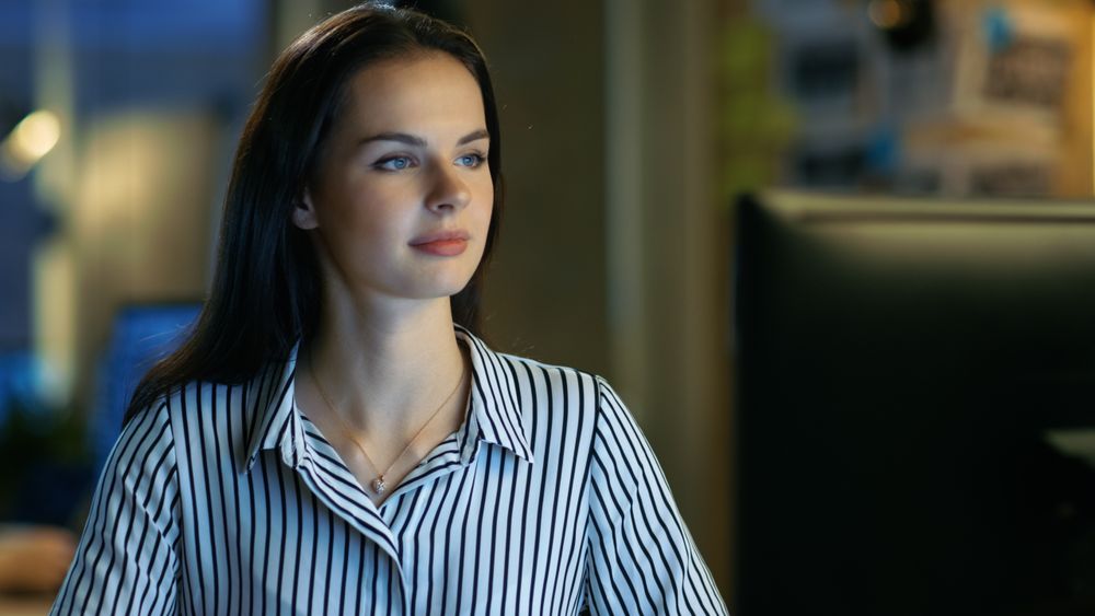 Woman Works on Personal Computer.