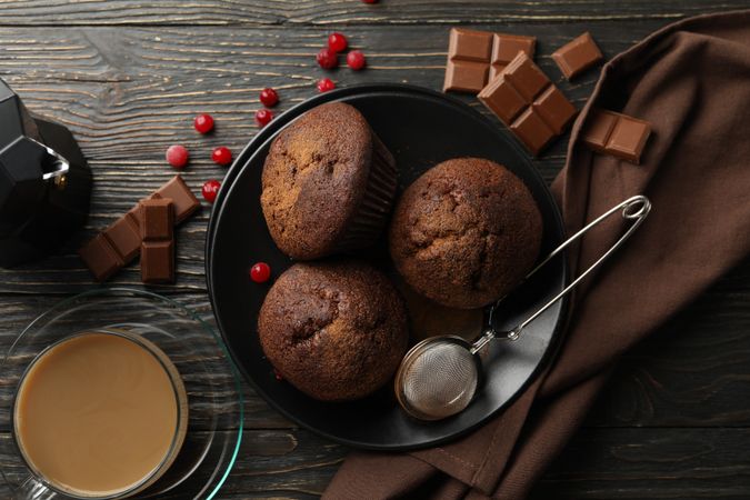 Composition with tasty muffins and cocoa drink on wooden background