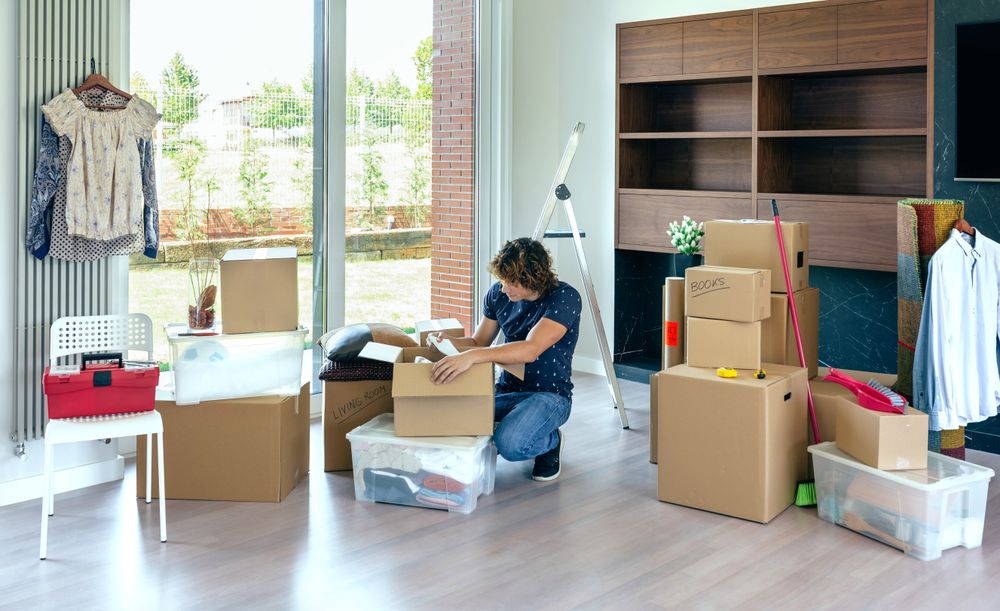 Man unpacking moving boxes