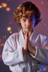 Boy in kimono doing greeting gesture