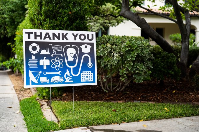 Yard sign thanking essential workers with icons
