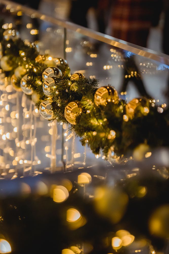 Green Christmas garland decorated on balustrade in close-up