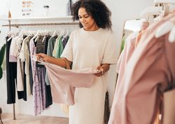 Black woman in a bright trendy clothes shop