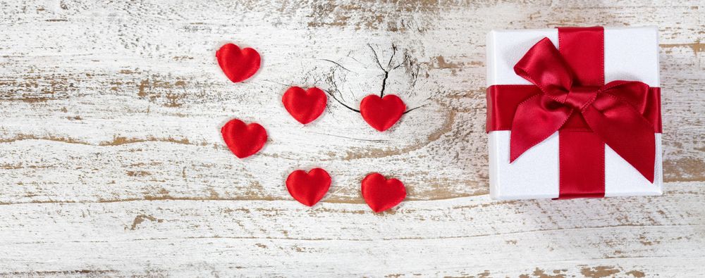 Gift box and red hearts for Valentine’s Day