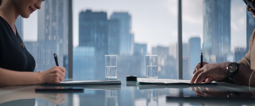 Female and Male Partners Sign Successful Deal, Shake Hands in Meeting Room Office.