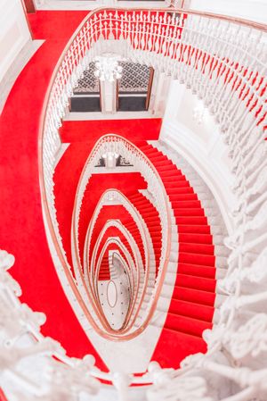 Above view of spiral staircase with red carpet
