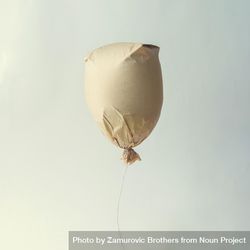 Paper bag balloon on light background 4NM1r5