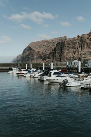 Small boats moored on pier