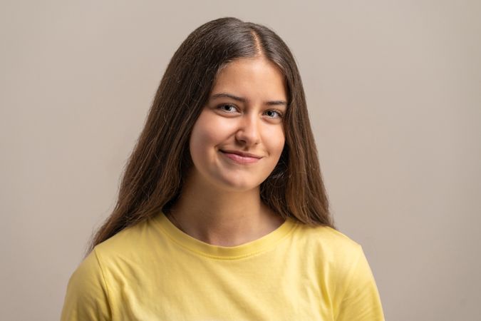 Natural close-up portrait of a friendly and authentic teenage girl.