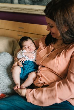 Woman hugging smiling daughter