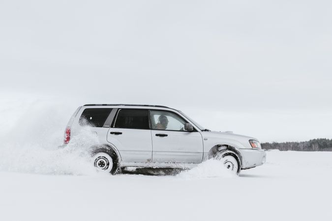 Car driving on snow field