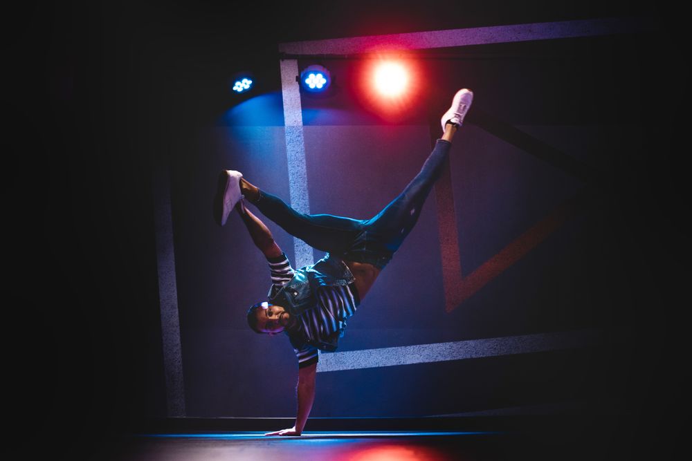 Man performing dance in spotlights