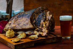 Roasted pork meat with garlic on board