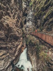 Traveller enjoying picturesque view of mountain ridge