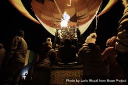 Hudson, WI, USA - February 8th, 2020: Hot air balloon being inflated for take off at dusk 0y7Yq4