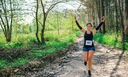 Young woman winning trail race