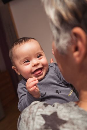 Portrait of cute baby boy with Down syndrome