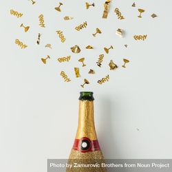 Golden Champagne Party Bottle On Light Background With Gold Confetti ...