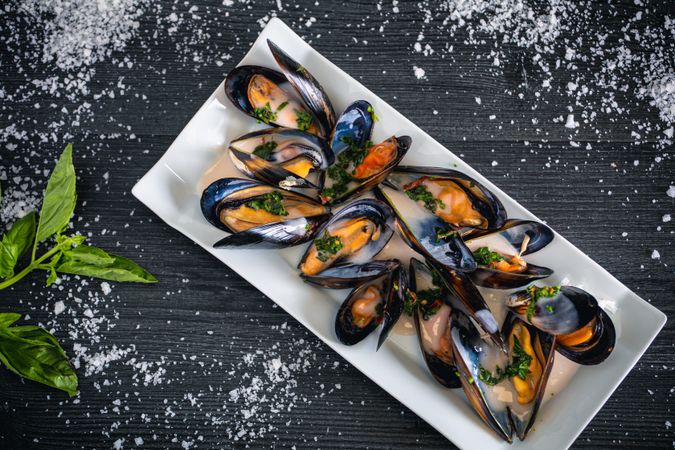 Steamed mussels with Thai sauce in plate
