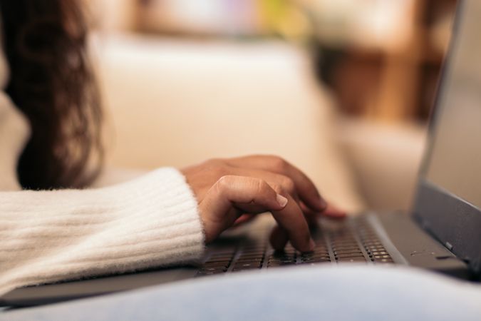 Home Productivity: Unrecognizable Woman Working on Laptop