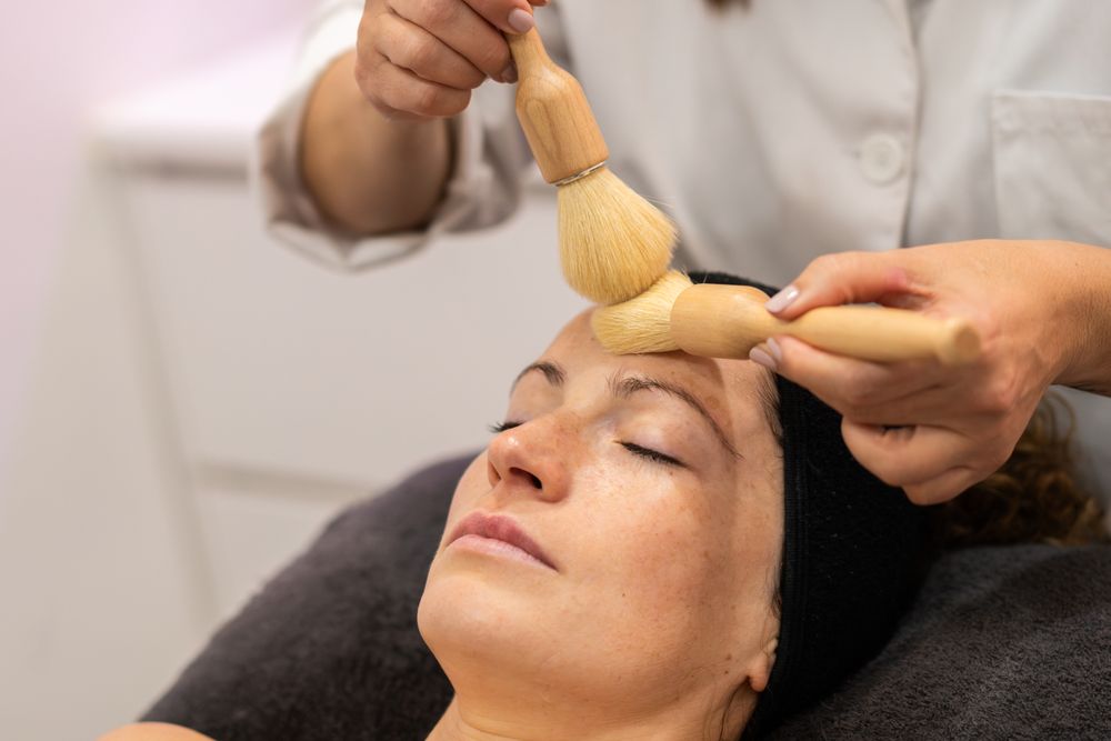 Woman receiving beauty treatment in salon