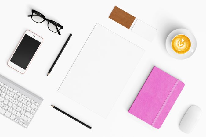 Modern workspace with coffee cup, smartphone, paper, tablet and notebook copy space