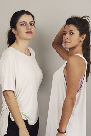 Sportswomen resting after training in studio