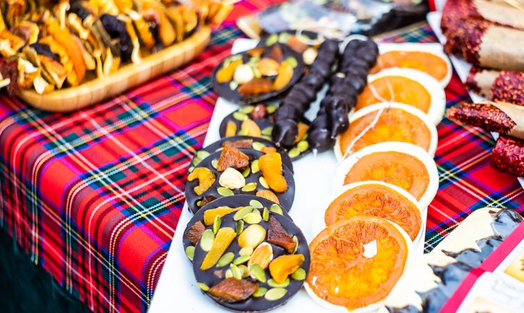 Christmas food concept of florentines and chocolate dipped orange slices